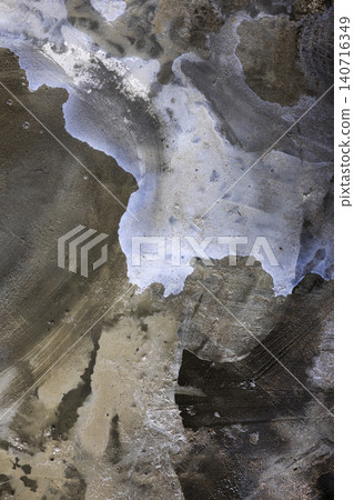 Water Stains On Concrete Surface. Abstract view of damp marks and moisture patterns on gray cement floor, suitable for industrial textures or architectural weathering concepts. Water Stains On Concrete Surface. Abstract view of damp marks and moisture patterns on gray cement floor, suitable for industrial textures or architectural weathering concepts. 140716349