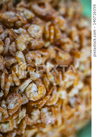 Dried Shrimps On Display At A Traditional Seafood Market. Close up of small dried shrimps for sale in local market, perfect for asian cuisine, ingredient and seafood industry themes. Dried Shrimps On Display At A Traditional Seafood Market. Close up of small dried shrimps for sale in local market, perfect for asian cuisine, ingredient and seafood industry themes. 140716359