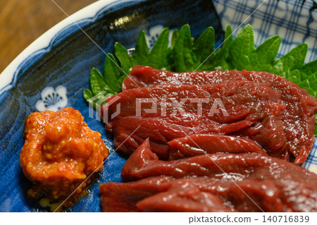 Local cuisine from the area around Lake Inawashiro in Fukushima Prefecture: Horse sashimi (served with perilla leaves and spicy miso paste) Local cuisine from the area around Lake Inawashiro in Fukushima Prefecture: Horse sashimi (served with perilla leaves and spicy miso paste) 140716839