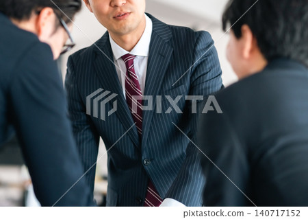 Business people having a meeting (faceless) 140717152
