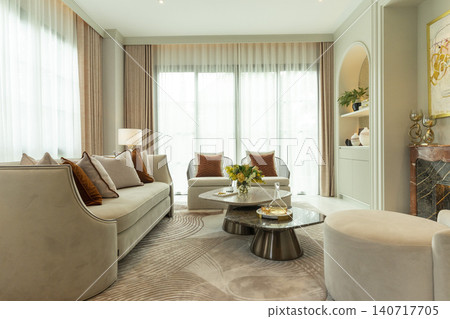 Light brown and white pillows  on sofa in the living room with area rug. 140717705