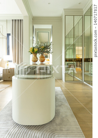 Luxury modern walk-in closet with mirror cabinets facades and island console. 140717817