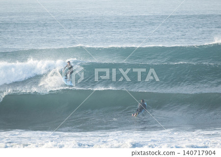 Shonan Kugenuma Beach: Surfing in the ocean, which has gotten bigger due to a low-pressure system. Shonan Kugenuma Beach: Surfing in the ocean, which has gotten bigger due to a low-pressure system. 140717904