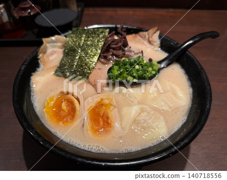 Pork bone broth ramen served in a black bowl. Pork bone broth ramen served in a black bowl. 140718556