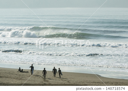 Shonan Kugenuma Beach: Surfers head out to sea as swells from a low-pressure system reach the ocean. 140718574