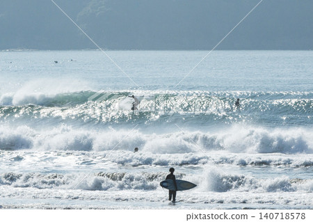 Shonan Kugenuma Beach: The sea with swells from a low-pressure system and surfers. Shonan Kugenuma Beach: The sea with swells from a low-pressure system and surfers. 140718578