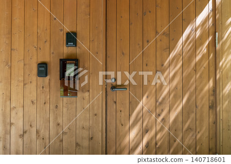 Wood-grain front door and keypad intercom 140718601