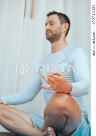 Close up hand of man practicing yoga and meditation at home Close up hand of man practicing yoga and meditation at home 140719322