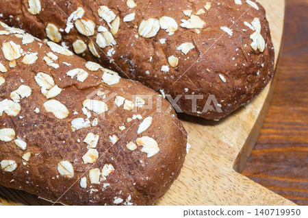 Wheat mini baguettes, brown bread. Close-up Wheat mini baguettes, brown bread. Close-up 140719950