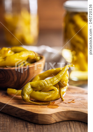 Pickled Banana Peppers On A Wooden Board .Rustic Preserved Snack 140720136