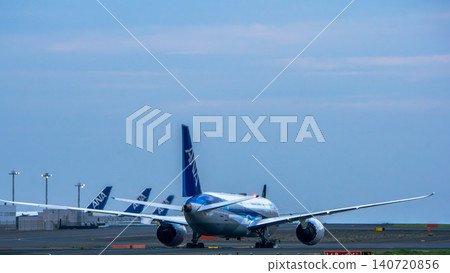 The rear view of an ANA airplane and the runway at Haneda Airport. The rear view of an ANA airplane and the runway at Haneda Airport. 140720856