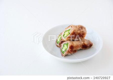 Freshly made okra wrapped in meat Freshly made okra wrapped in meat 140720927