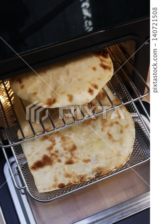 Freshly Cooked Flatbreads in a Metal Basket 140721508
