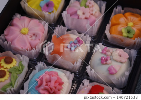 Colorful Flower-Decorated Pastries in Display Cases 140721538