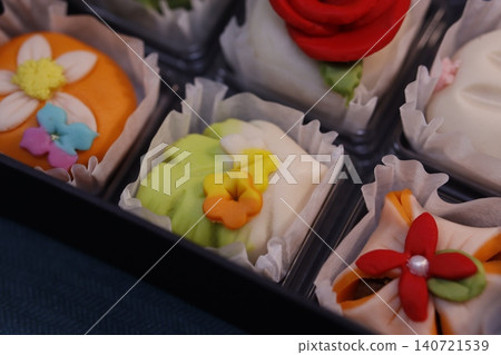 Colorful Floral Pastries in a Box Colorful Floral Pastries in a Box 140721539