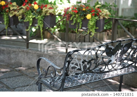 A shady bench and a flower garden. A shady bench and a flower garden. 140721831