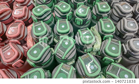 Rows of matte green and pink plastic drink bottles top view Rows of matte green and pink plastic drink bottles top view 140721838