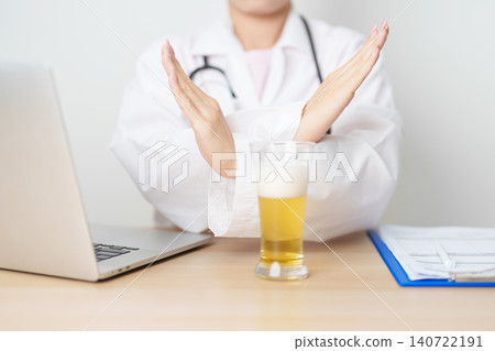Doctor hand stop to refuse Beer, quitting drink for healthy liver, prevent Alcoholic cirrhosis and cancer, World No Alcohol Day, medical advice for sobriety and Alcoholism and addiction concept Doctor hand stop to refuse Beer, quitting drink for healthy liver, prevent Alcoholic cirrhosis and cancer, World No Alcohol Day, medical advice for sobriety and Alcoholism and addiction concept 140722191