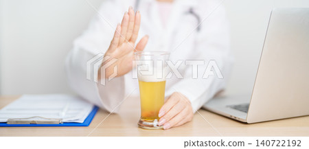 Doctor hand stop to refuse Beer, quitting drink for healthy liver, prevent Alcoholic cirrhosis and cancer, World No Alcohol Day, medical advice for sobriety and Alcoholism and addiction concept Doctor hand stop to refuse Beer, quitting drink for healthy liver, prevent Alcoholic cirrhosis and cancer, World No Alcohol Day, medical advice for sobriety and Alcoholism and addiction concept 140722192