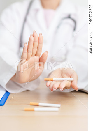 doctor hand making stop sign to refuse and breaking cigarette, quitting smoking for healthy lungs, prevent Lung Cancer and Emphysema, World No Tobacco Day concept doctor hand making stop sign to refuse and breaking cigarette, quitting smoking for healthy lungs, prevent Lung Cancer and Emphysema, World No Tobacco Day concept 140722202
