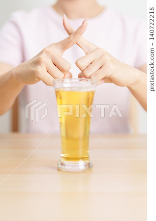 woman making stop hand gesture to refuse a glass of Beer, Healthy man say no to alcohol drink, stop alcoholism and addiction concept. Responsible man reject a drink before driving and quit booze woman making stop hand gesture to refuse a glass of Beer, Healthy man say no to alcohol drink, stop alcoholism and addiction concept. Responsible man reject a drink before driving and quit booze 140722218