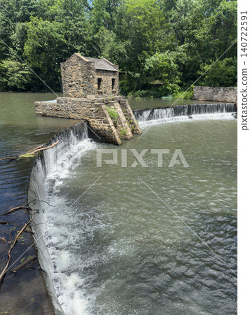 A scene from Speedwell Park in Morristown, USA: water cascading down and a stone dam. A scene from Speedwell Park in Morristown, USA: water cascading down and a stone dam. 140722591