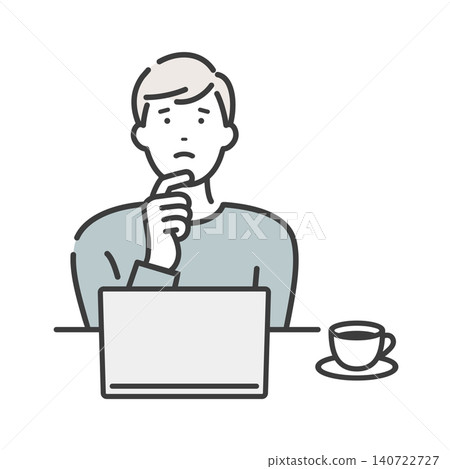 A young man thinking while looking at his computer. 140722727