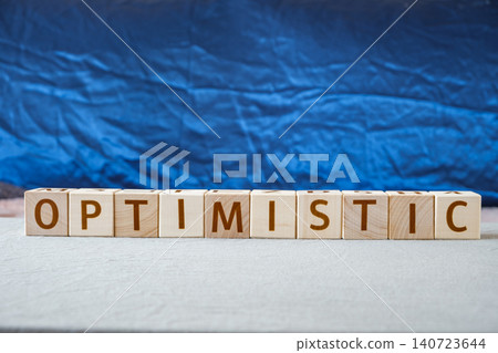 optimistic, motivational word made of letters on wooden cubes optimistic, motivational word made of letters on wooden cubes 140723644