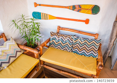 sofas and decorative paddles on the cafe wall sofas and decorative paddles on the cafe wall 140723659