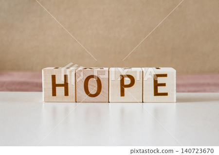 hope, motivational word made of letters on wooden cubes hope, motivational word made of letters on wooden cubes 140723670