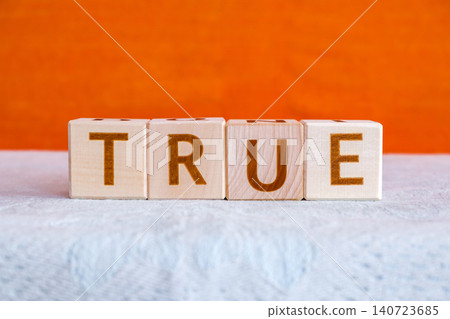 true, motivational word made of letters on wooden cubes true, motivational word made of letters on wooden cubes 140723685