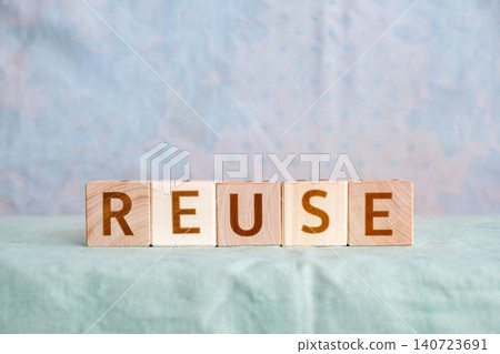 reuse, motivational word made of letters on wooden cubes reuse, motivational word made of letters on wooden cubes 140723691