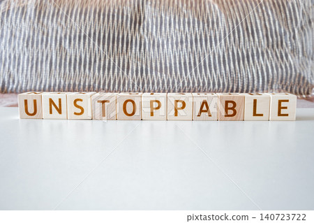 unstoppable, motivational word made of letters on wooden cubes unstoppable, motivational word made of letters on wooden cubes 140723722