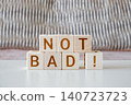 not bad !, motivational phrase made of letters on wooden cubes 140723723