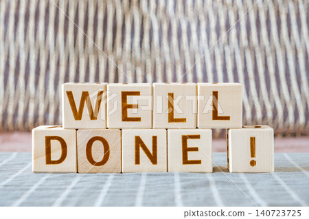 well done !, motivational phrase made of letters on wooden cubes well done !, motivational phrase made of letters on wooden cubes 140723725