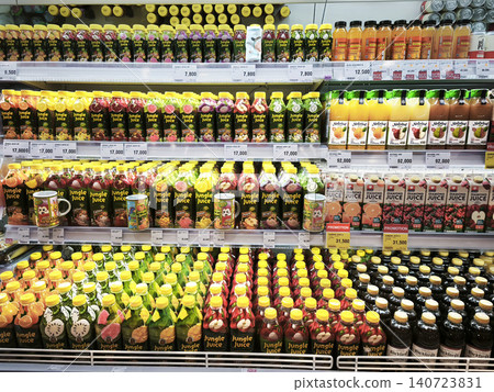 SURABAYA, INDONESIA - June 12, 2026. Various colorful bottled fruit juices and beverages arranged on shelves in a supermarket refrigerator display. SURABAYA, INDONESIA - June 12, 2026. Various colorful bottled fruit juices and beverages arranged on shelves in a supermarket refrigerator display. 140723831