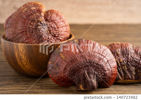 Dried lingzhi mushroom with capsule drug, alternative medicine herbal organic herb. Dried lingzhi mushroom with capsule drug, alternative medicine herbal organic herb. 140723982