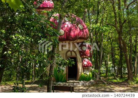 Green forest fairytale mushroom house and colorful miniature wooden house garden landscape decoration Green forest fairytale mushroom house and colorful miniature wooden house garden landscape decoration 140724439