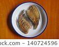 Snakeskin gourami crispy fried fishes in Thai local style white plate 140724596