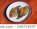 Snakeskin gourami crispy fried fishes in Thai local style white plate 140724597