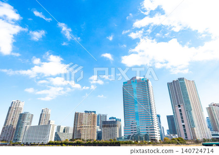 A riverside landscape lined with high-rise apartment buildings. A riverside landscape lined with high-rise apartment buildings. 140724714