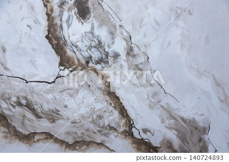 Textured abstract design featuring swirling browns and whites with visible cracks and lines showcasing a unique art style reminiscent of natural formations Textured abstract design featuring swirling browns and whites with visible cracks and lines showcasing a unique art style reminiscent of natural formations 140724893