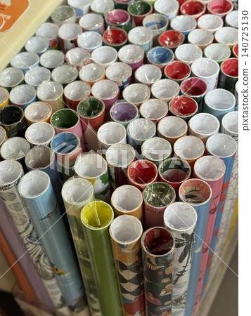 Gift wrapping paper rolls displayed in a vertical arrangement viewed from above Gift wrapping paper rolls displayed in a vertical arrangement viewed from above 140725130
