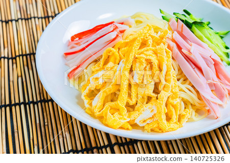 Cold ramen served against a bamboo screen background. Cold ramen served against a bamboo screen background. 140725326