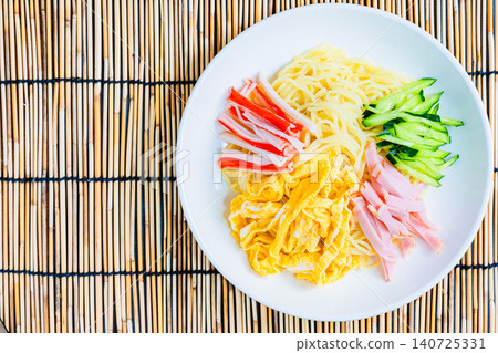 Cold ramen served against a bamboo screen background. Cold ramen served against a bamboo screen background. 140725331