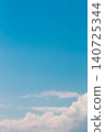Background image of blue sky and white clouds, with copy space, vertical orientation. 140725344