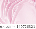 Smooth elegant pink silk or satin texture as wedding background. Luxurious background design 140726321