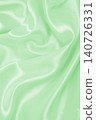 Smooth elegant green silk or satin luxury cloth texture as abstract background. Luxurious background design 140726331