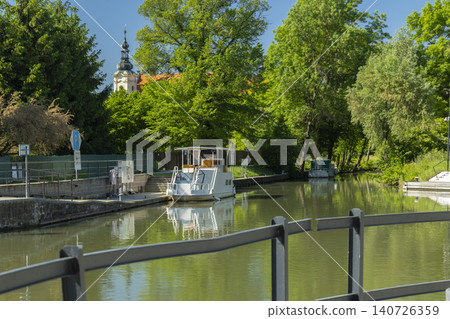 White boat docking on Bata canal in Straznice 140726359