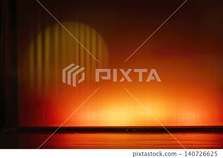 Empty stage illuminated by warm orange spotlight Empty stage illuminated by warm orange spotlight 140726625